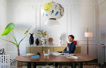 a person sitting at a desk with their feet up