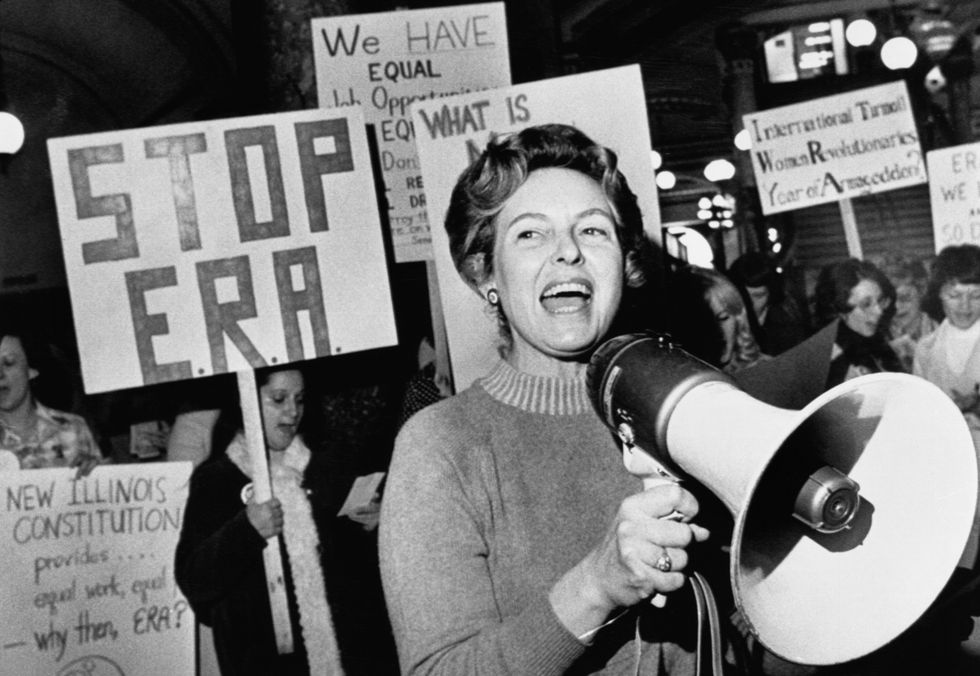 Phyllis Schlafly leads members opposed to the equal rights amendment in a song