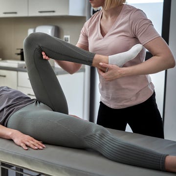 physical therapist treating patient at clinic