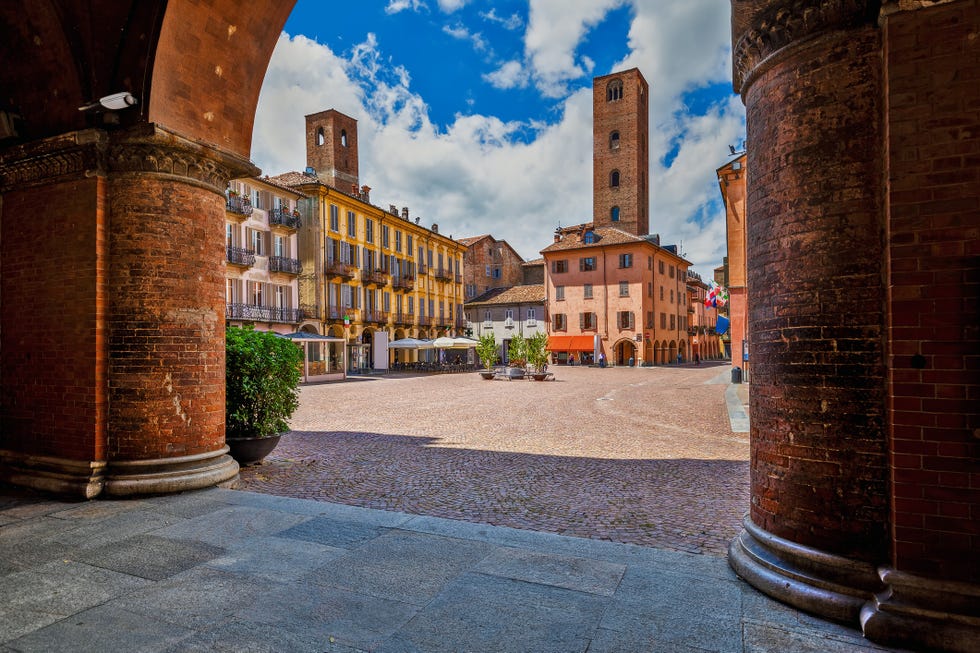 piazza duomo and old historic houses in alba, italy