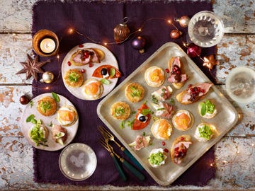 Christmas canapés with fairy lights, candles and decorations  