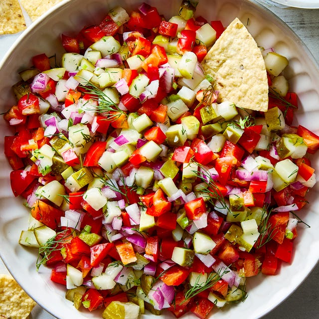 Pickle De Gallo chopped pickles, tomatoes, and onions in a bowl with tortilla chips