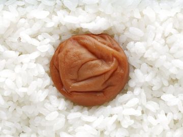 A pickled plum in white rice