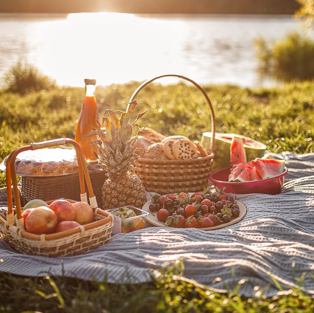 https://hips.hearstapps.com/hmg-prod/images/picnic-by-the-lake-basket-with-berries-bread-with-royalty-free-image-1652466320.jpg?crop=0.668xw:1.00xh;0.136xw,0&resize=640:*