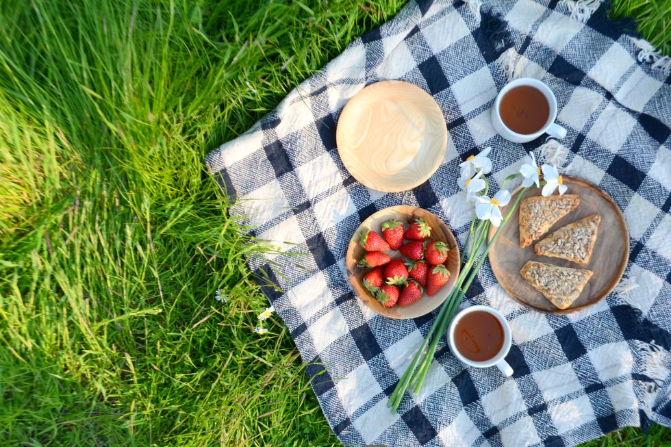 picnic basket photo featuring coffee and strawberries
