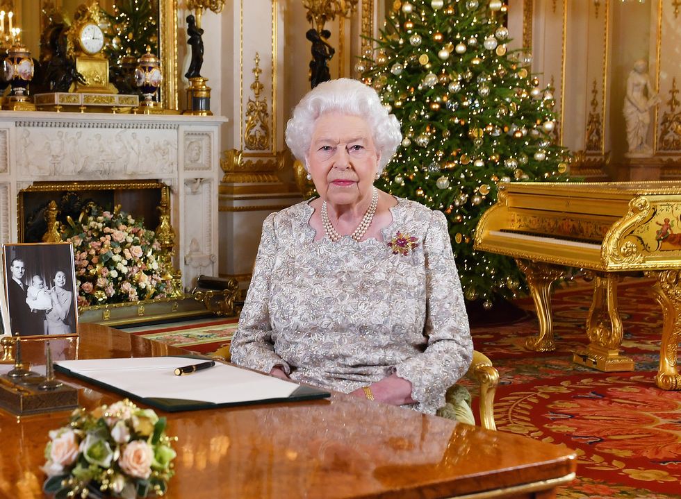 Queen Elizabeth II posing for a photograph after she recorded her annual Christmas Day message, in the White Drawing Room of Buckingham Palace in central London