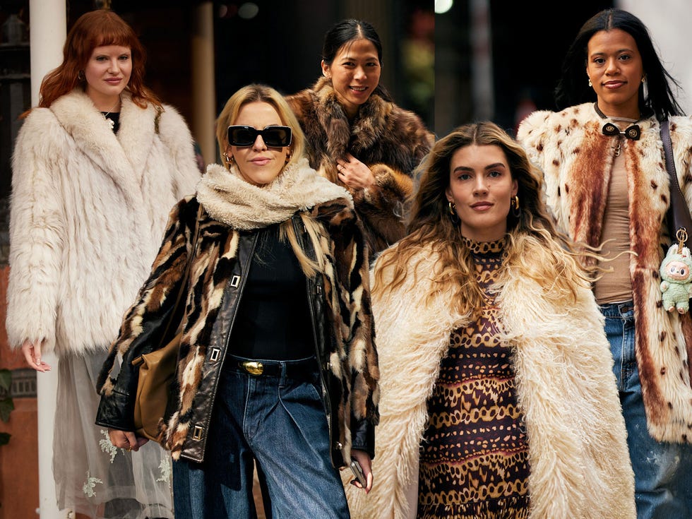 group of individuals dressed in various fashionable coats and outfits