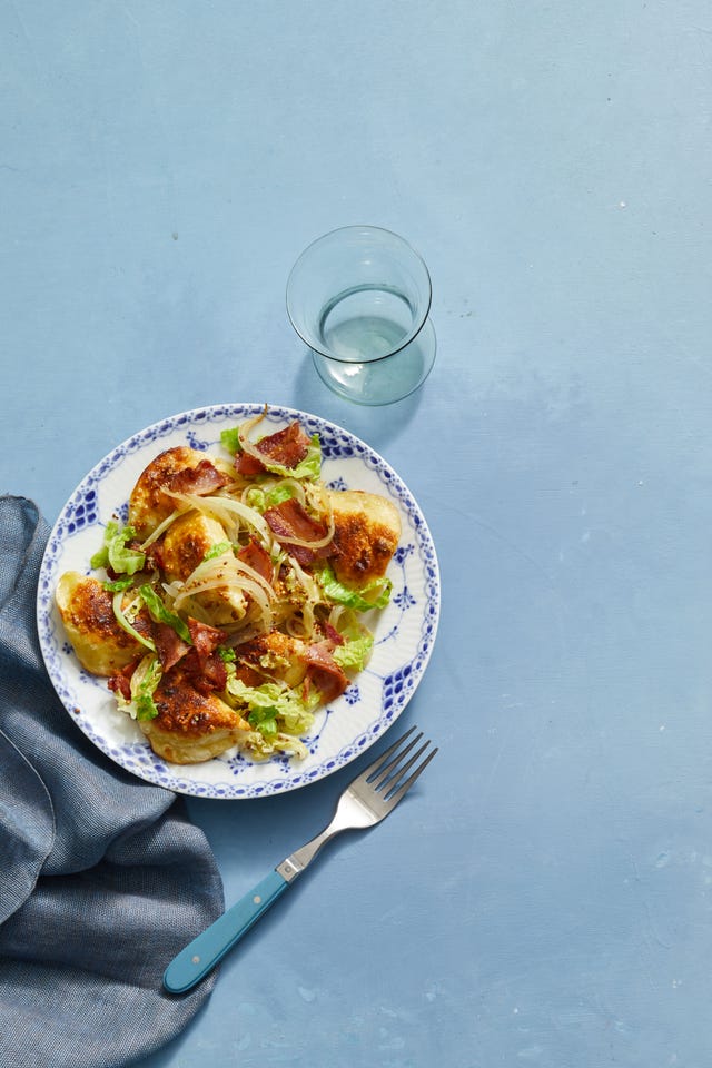 pierogi with mixed cabbage on a blue and white plate