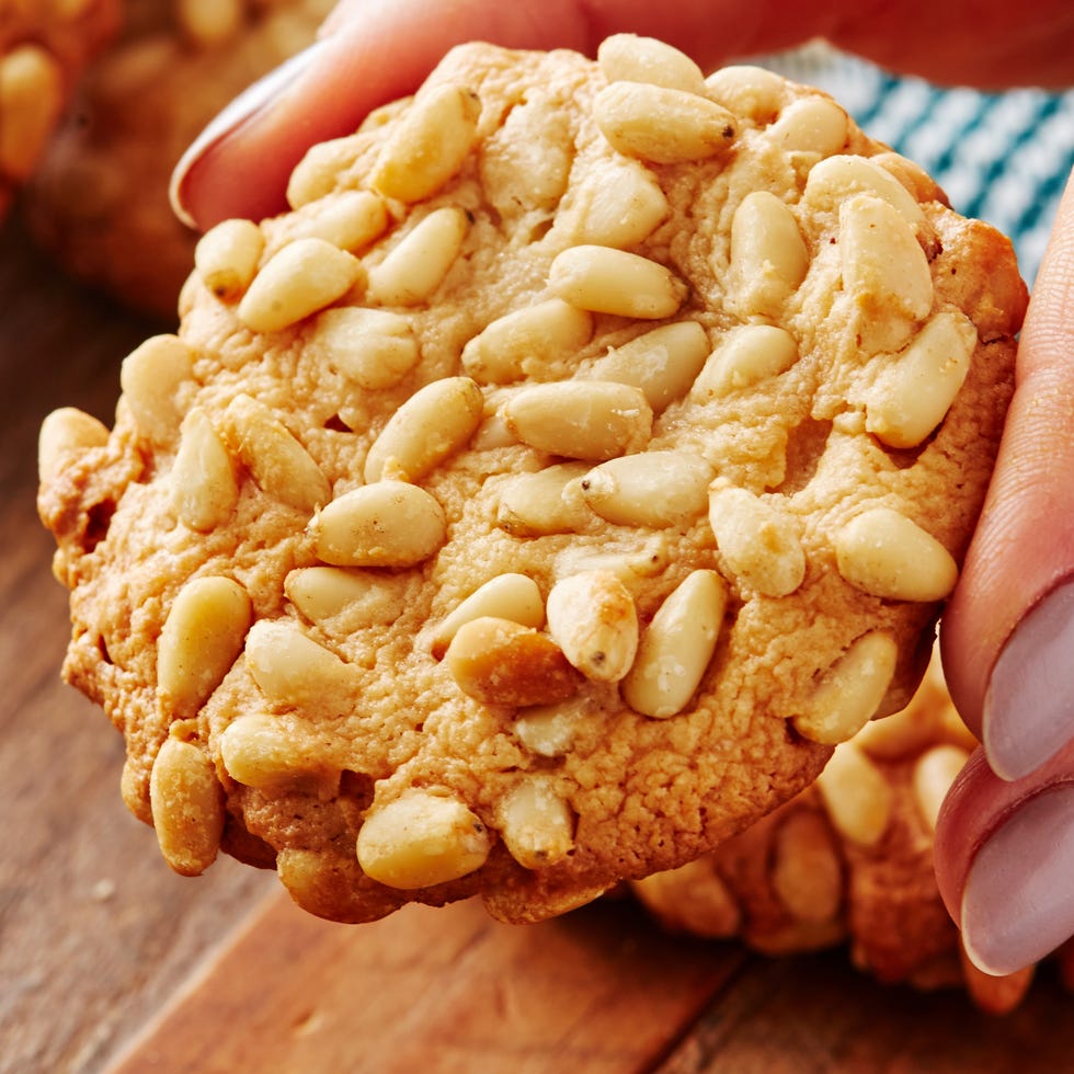 pignoli cookies topped with toasted pine nuts