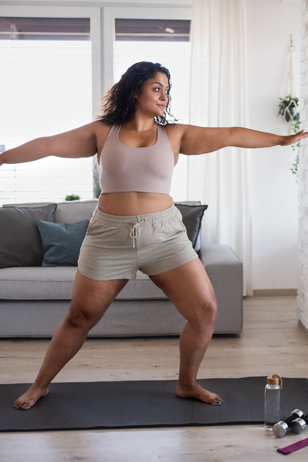 mixed race woman doing sport at home
