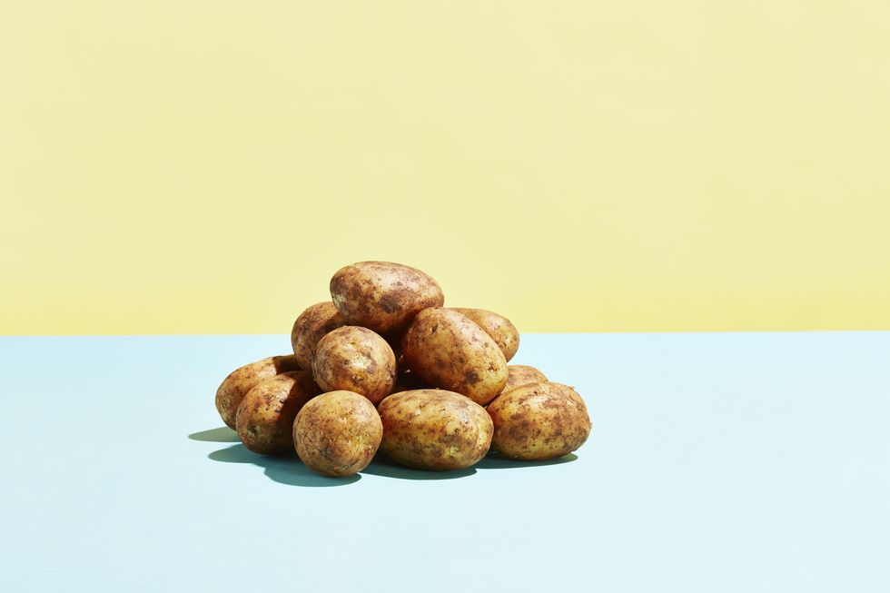 a pile of potatoes on a table top