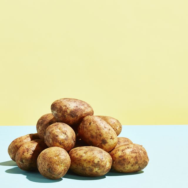a pile of potatoes on a table top