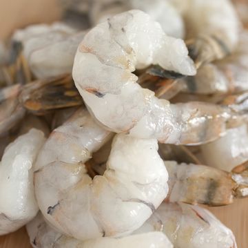 pile of shrimp on a wooden countertop
