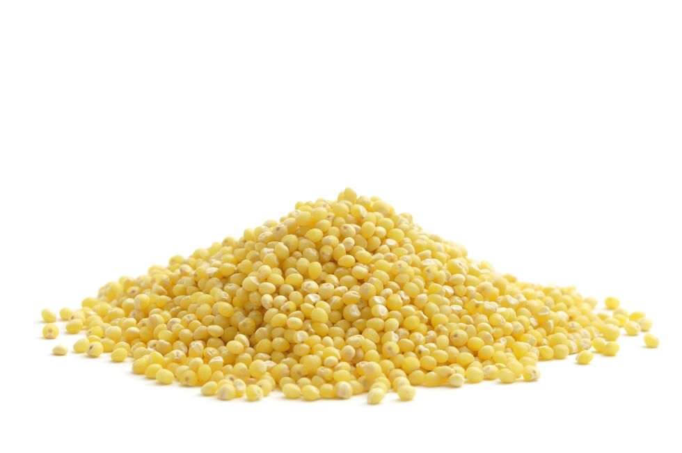 a pile of the food millet on a white background
