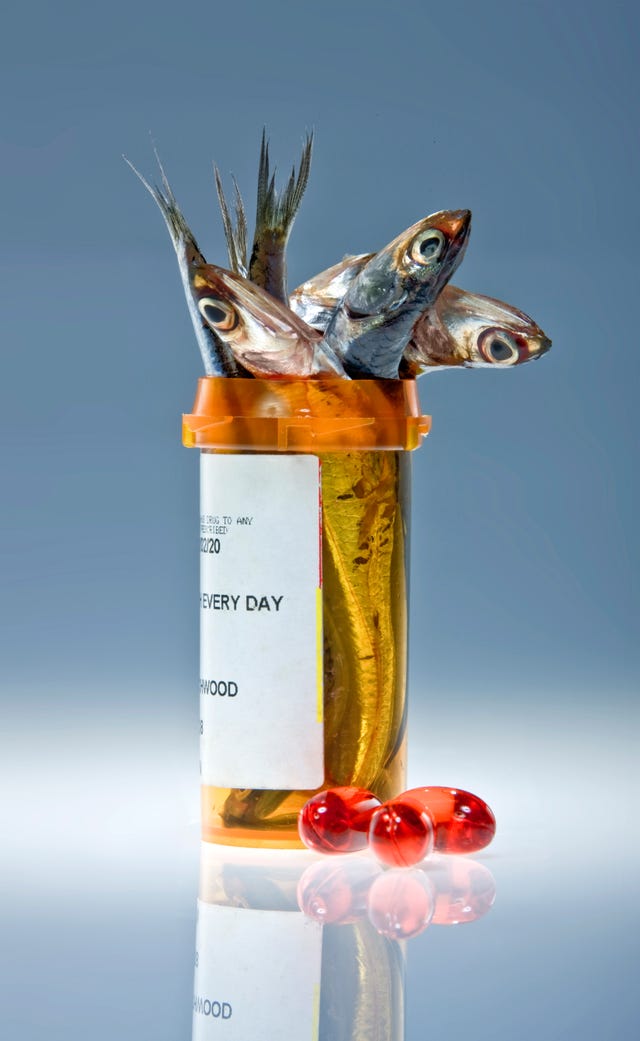 Pill bottle filled with anchovies