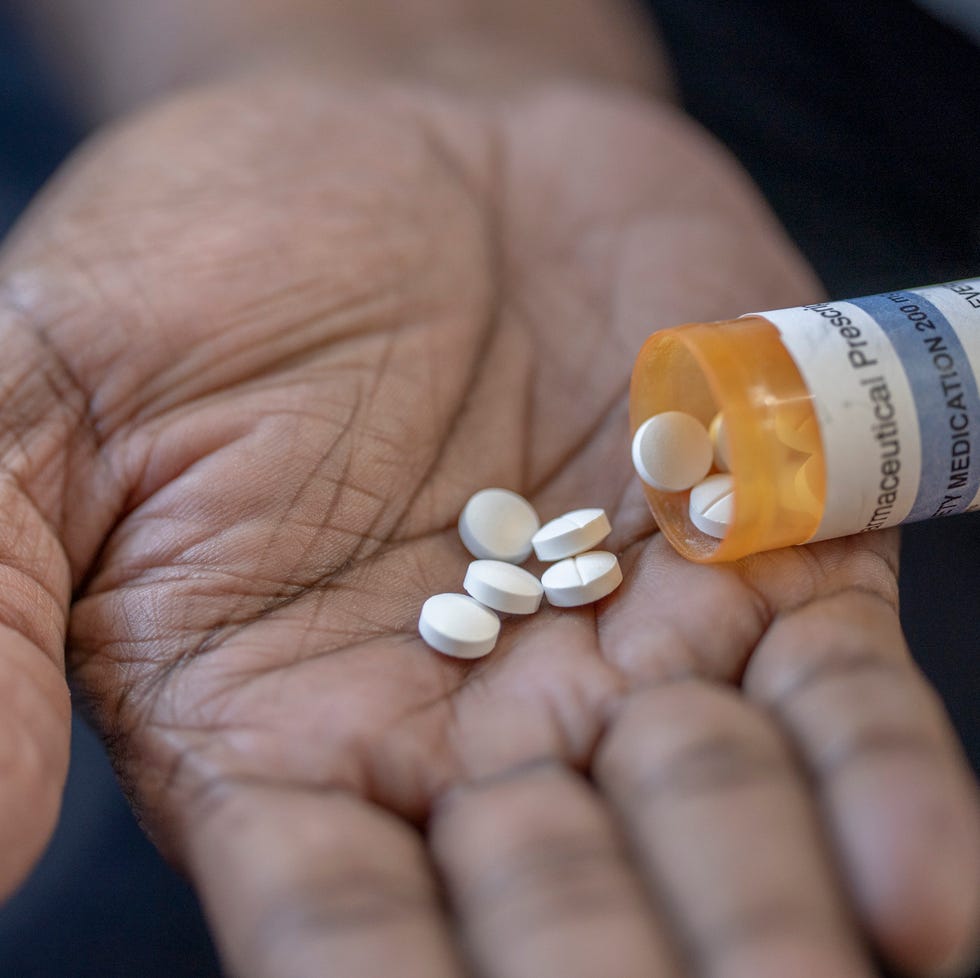 cropped shot of a mature male taking medication at home