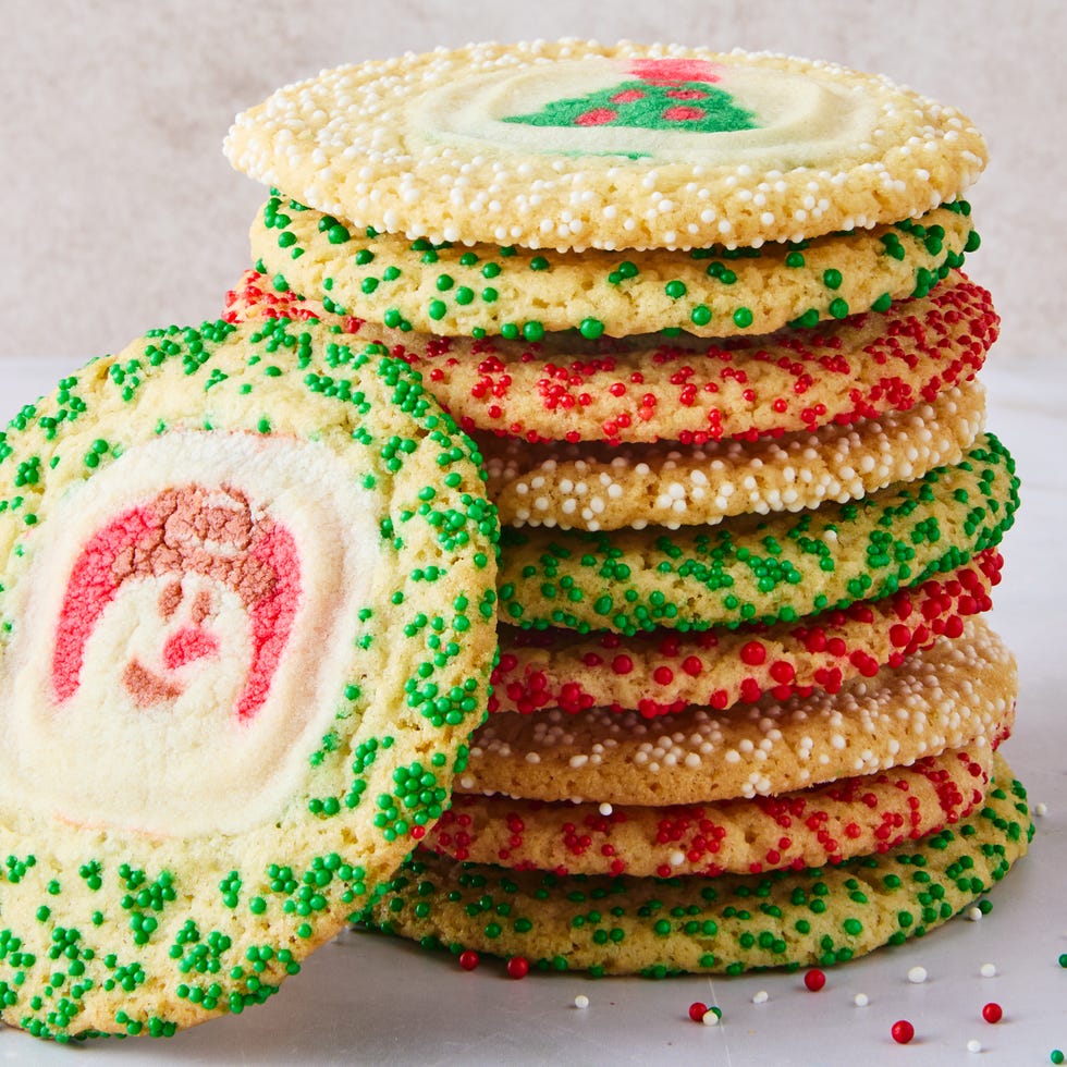 sugar cookie with christmas pillsbury sugar cookies in the middle surrounded by sprinkles