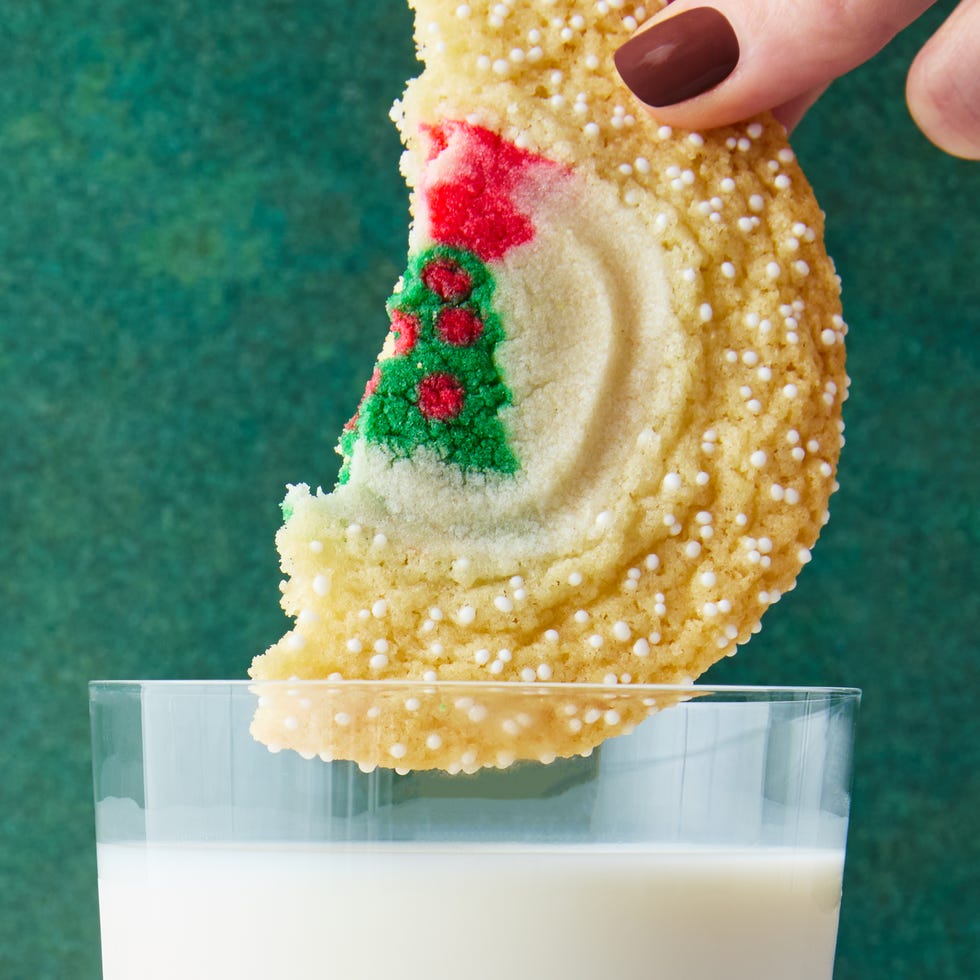 sugar cookie with christmas pillsbury sugar cookies in the middle surrounded by sprinkles