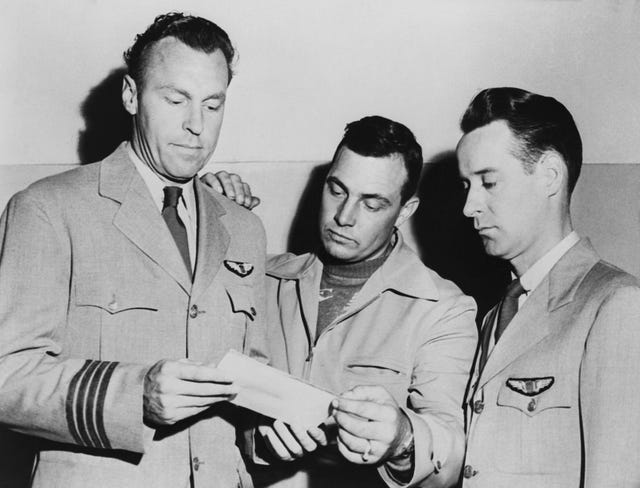 pilots looking at photo of ufo