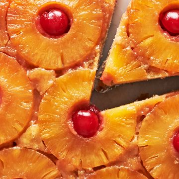 pineapple upside down cake topped with pineapple circles and cherries