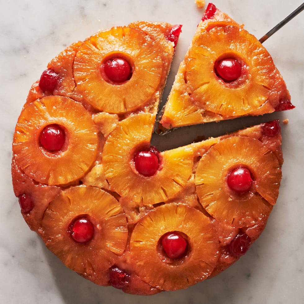 pineapple upside down cake topped with pineapple circles and cherries