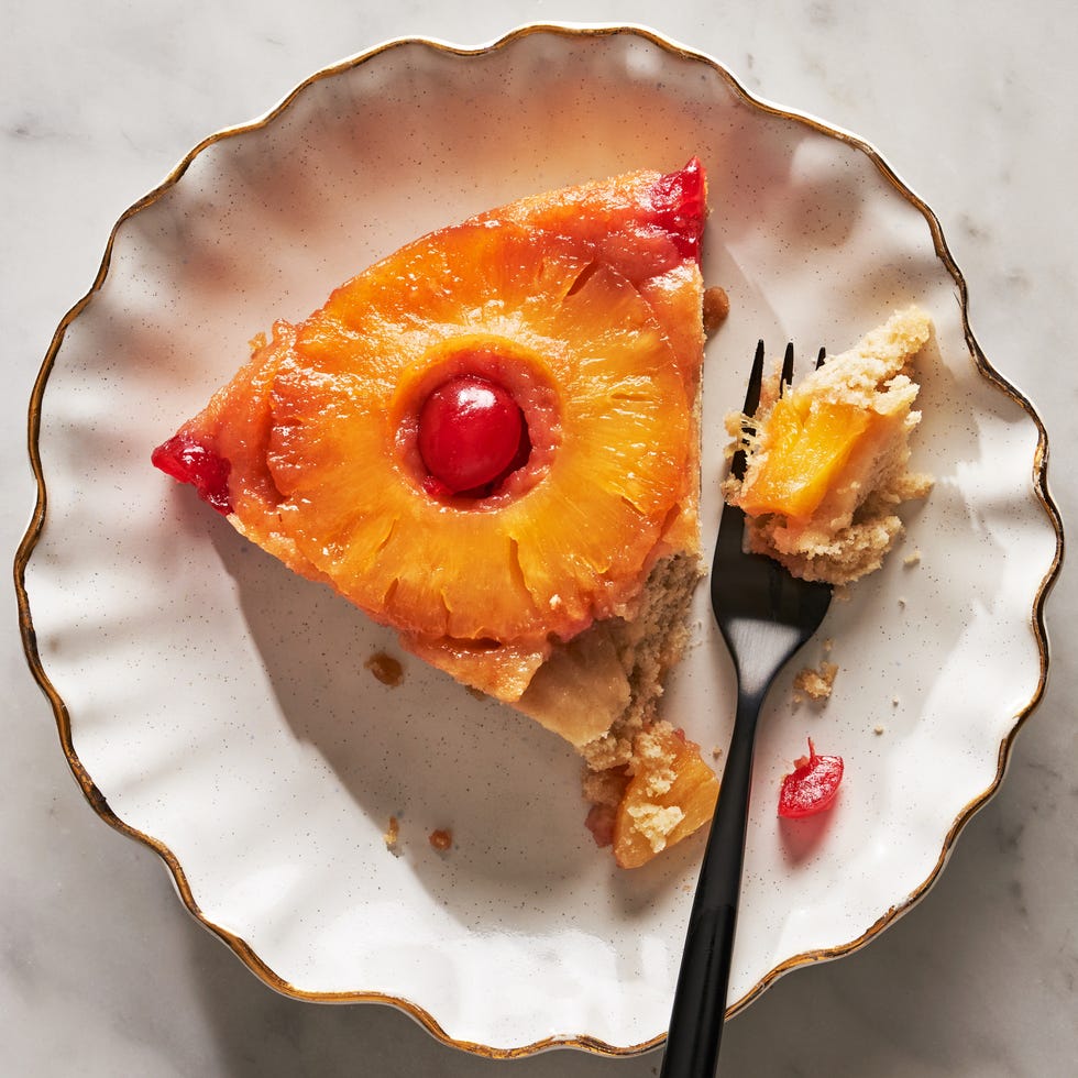 pineapple upside down cake topped with pineapple circles and cherries