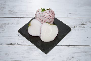 pineberry white strawberry and the fruit in half