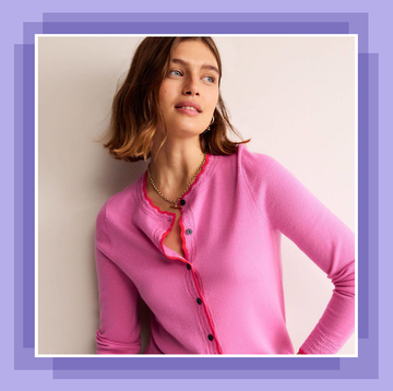 model in a pink cardigan