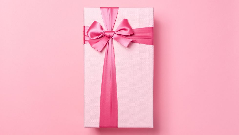 pink colored gift box on pink