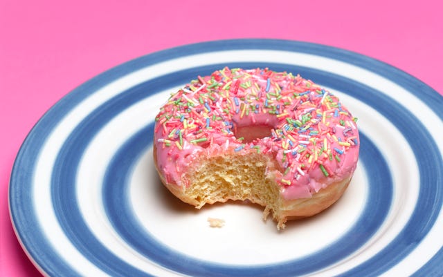 https://hips.hearstapps.com/hmg-prod/images/pink-doughnut-on-plate-royalty-free-image-1648553296.jpg?crop=0.627xw:1.00xh;0.251xw,0&resize=640:*