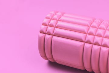 pink foam roller on pink background