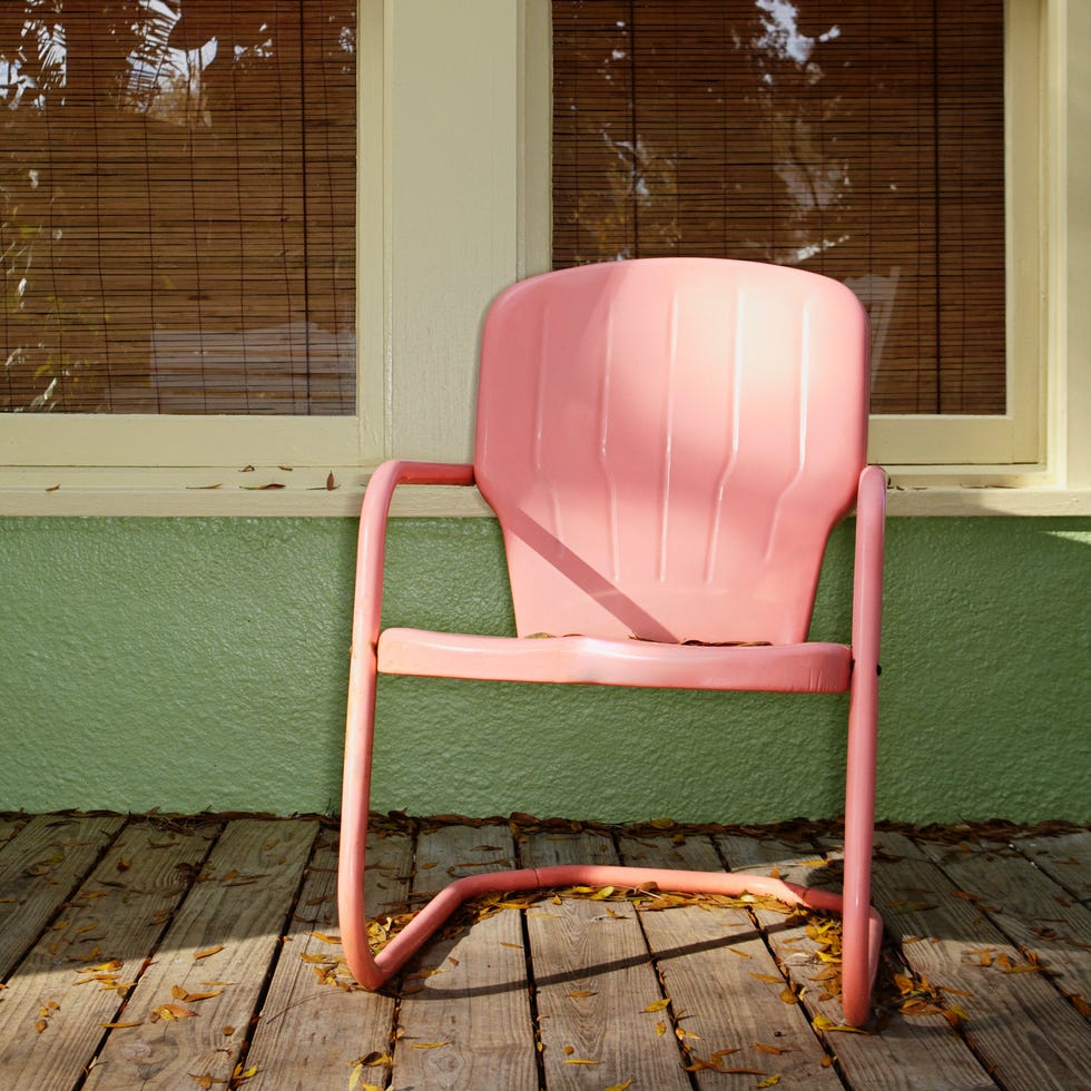 pink metal chair on a porch