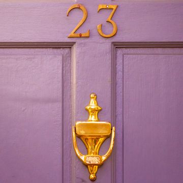 house number 23 on purple front door