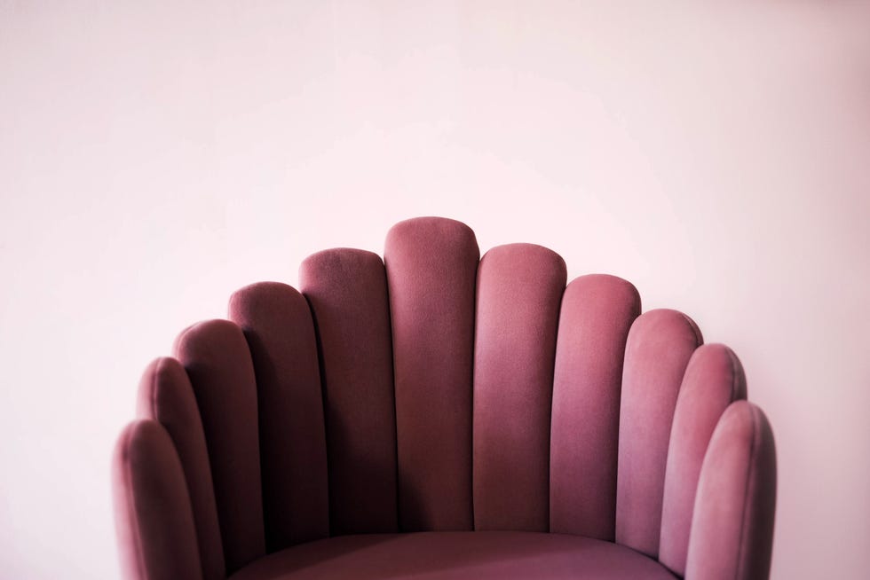 pink textured velor armchair on a pink background