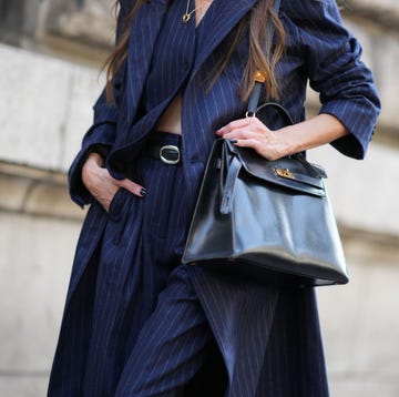 10 Best Ways to Wear Pinstripes This Fall paris, france september 30 a guest wears a blue striped outfit and a black leather hermes bag, outside hermes, during the womenswear springsummer 2024 as part of paris fashion week on september 30, 2023 in paris, france photo by edward berthelotgetty images
