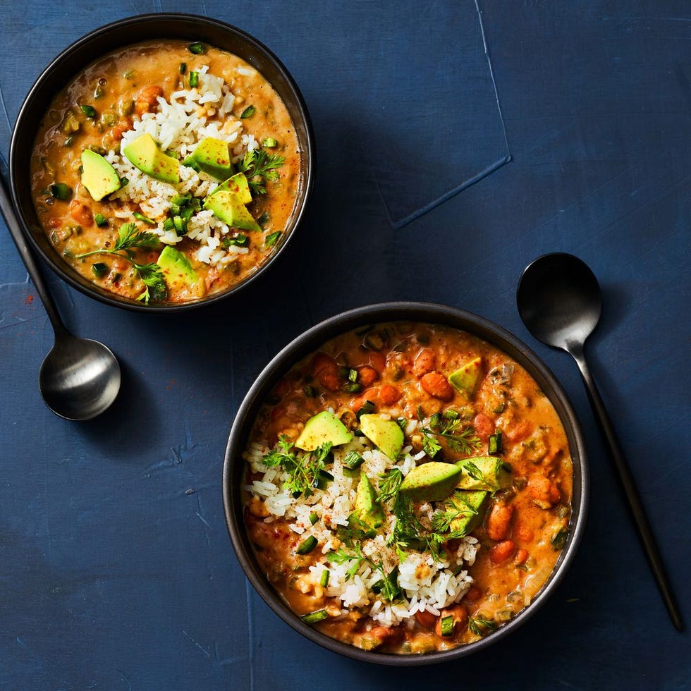 pinto bean and poblano soup with avocado and white rice served on top
