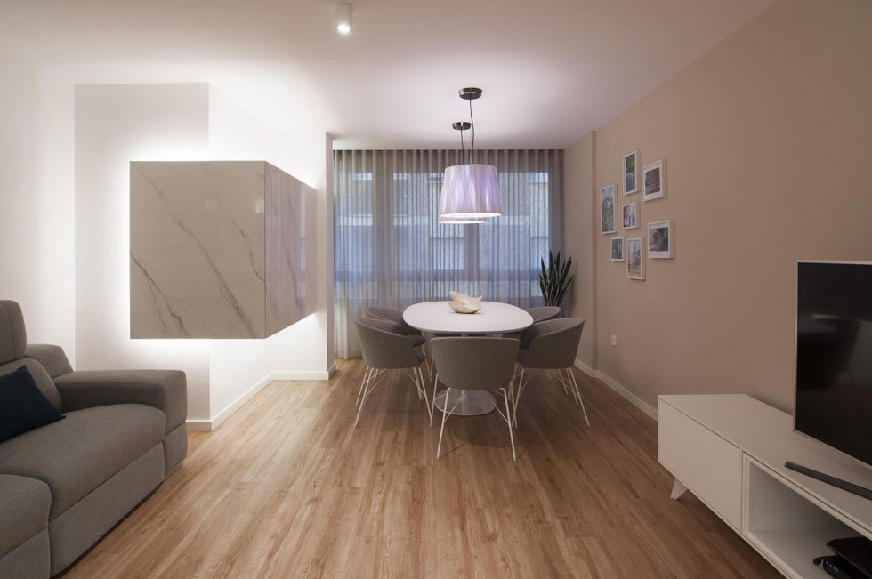 salón comedor de diseño nórdico decorado en tonos grises y blancos