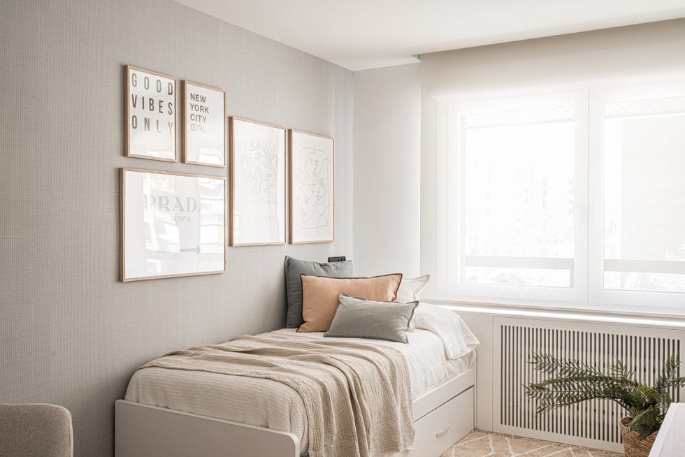 cama nido y pared con ilustraciones