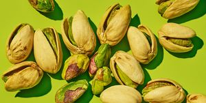pistachios on green background