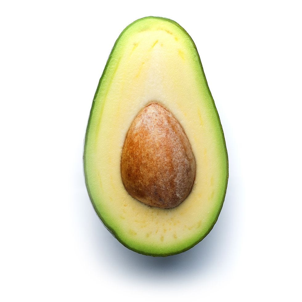 a green avocado with a brown center