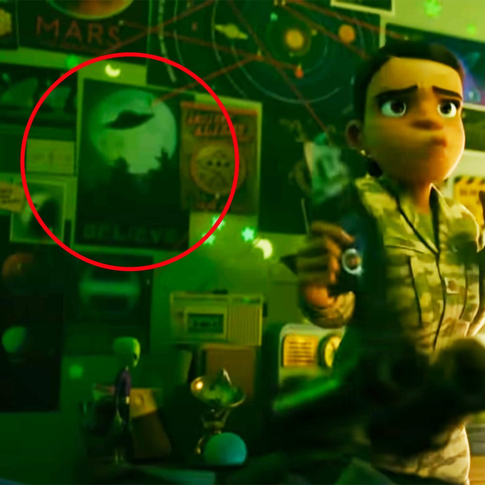 a room with posters about space and aliens including a ufo