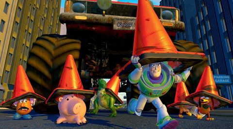buzz, rex, slinky dog and other members of the toy story gang hide under traffic cones in a scene from toy story 2