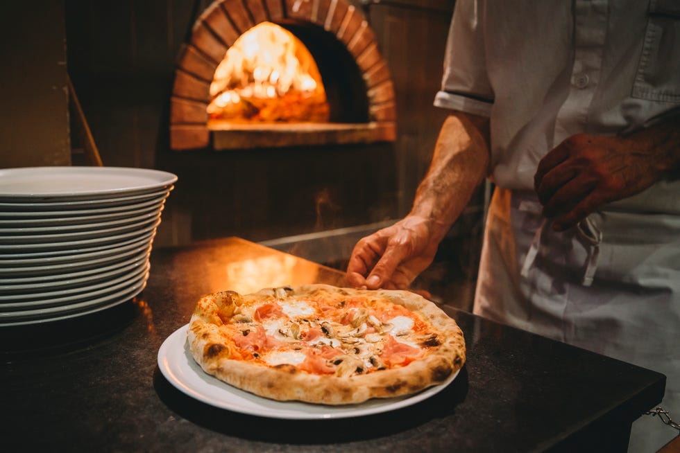 pizza chef preparing pizza at the restaurant