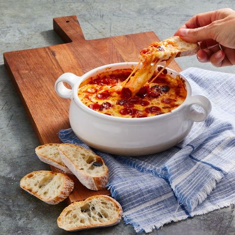 pepperoni pizza dip in a white bowl