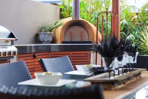 outdoor kitchen ideas stainless steel bbq and pizza oven