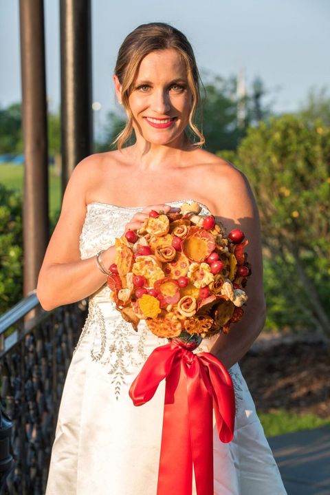 Bride, Bouquet, Photograph, Dress, Clothing, Red, Wedding dress, Yellow, Ceremony, Cut flowers, 
