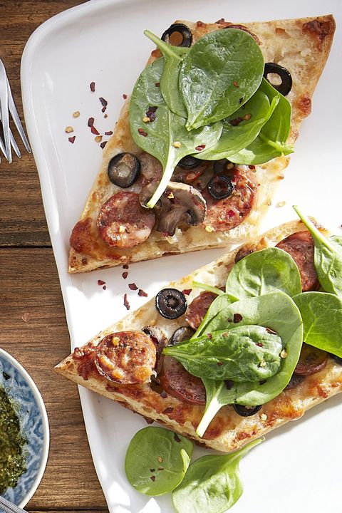 sausage, mushroom, and black olive white pizzas