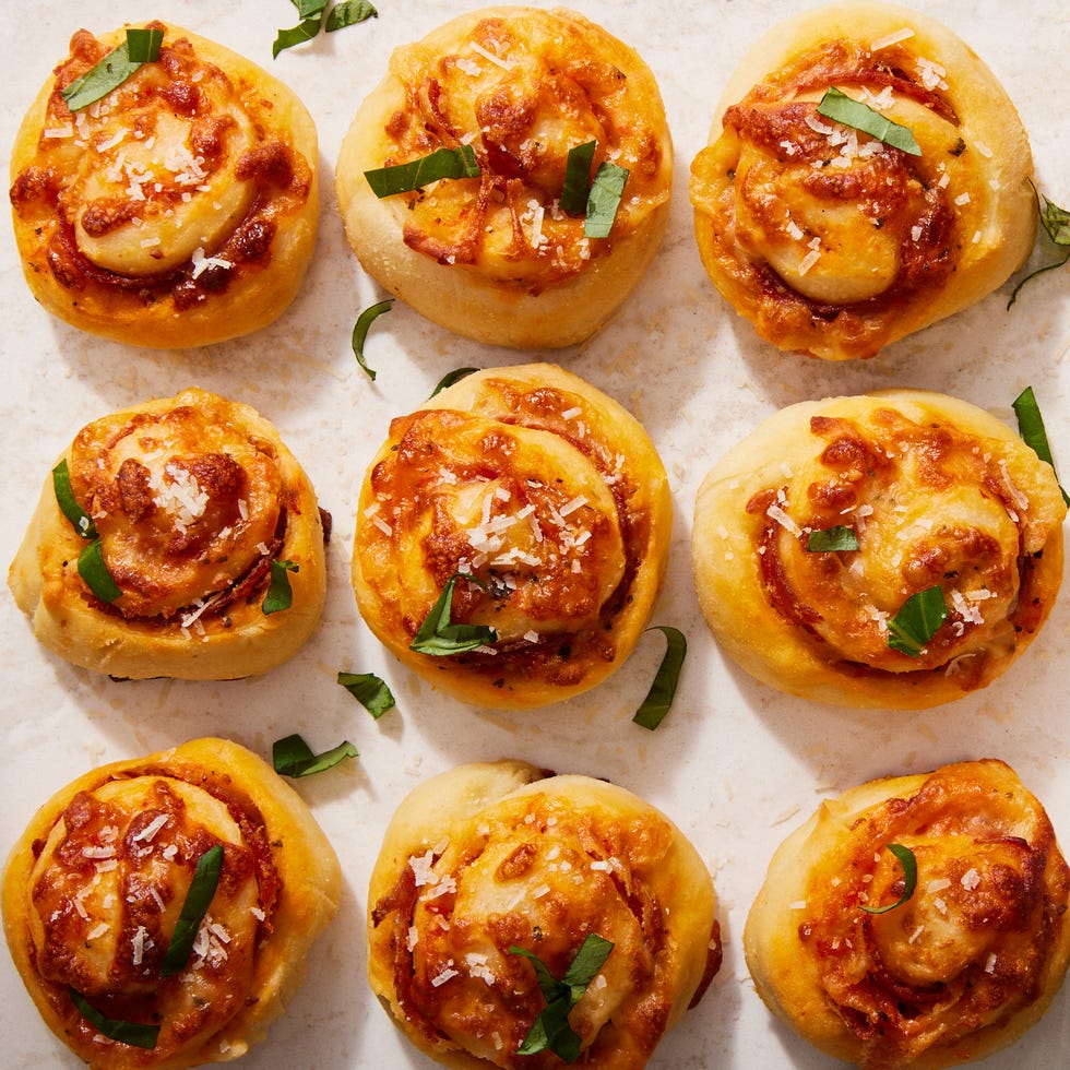 pizza rolls topped with chopped basil and parmesan