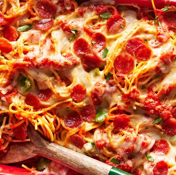 pizza spaghetti with cheese and pepperoni in a baking dish