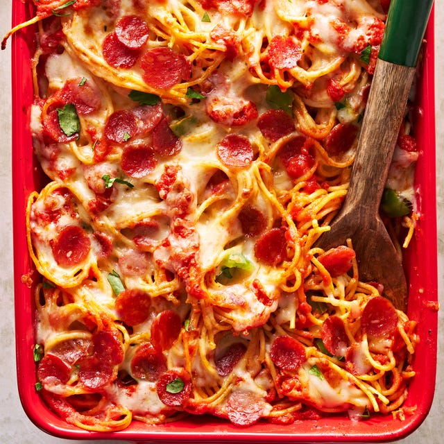 Pizza Spaghetti pizza spaghetti with cheese and pepperoni in a baking dish